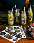 Halloween potion bottle labels stickers with spooky names like Spider Venom and Homemade Poison, DIY drink labels for Halloween party beverages, witch potion stickers for mason jars and bottles with Halloween candy decorations