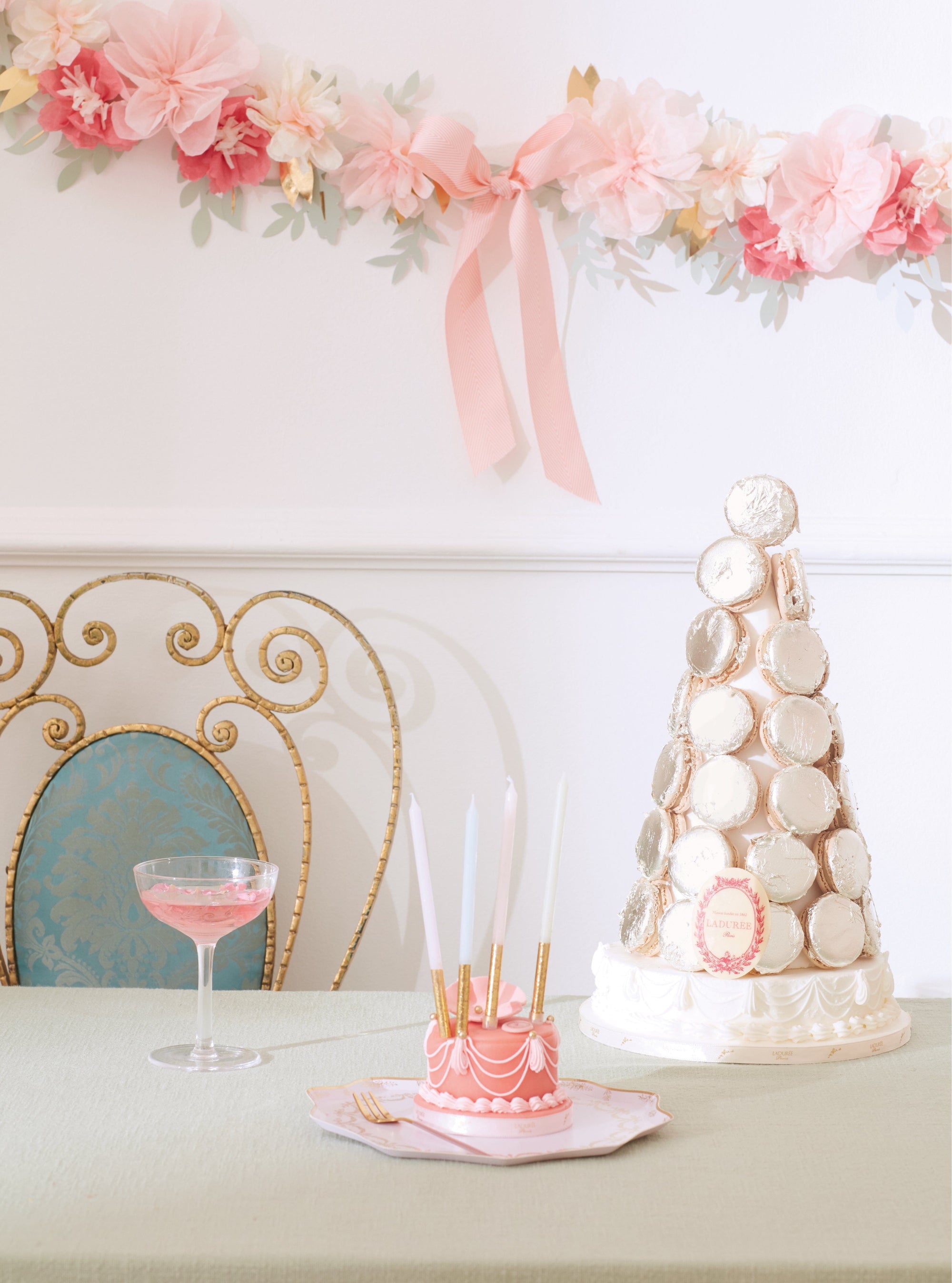Pink tissue paper flower garland with macaron tower - Meri Meri Laduree party decorations for tea parties