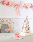 Pink tissue paper flower garland with macaron tower - Meri Meri Laduree party decorations for tea parties