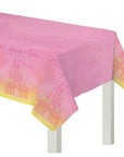 A pink tablecloth with a Disney Princess castle pattern and 'Once upon a time.