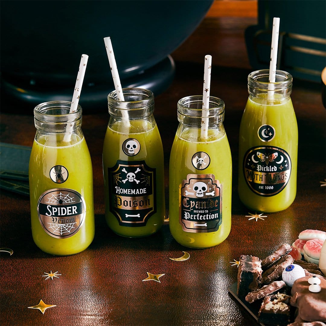 lose-up Halloween potion bottle labels on yellow drinks with paper straws, Spider Venom and Pickled Moth Wings stickers, Halloween beverage labels for party drinks and spooky cocktail decorations