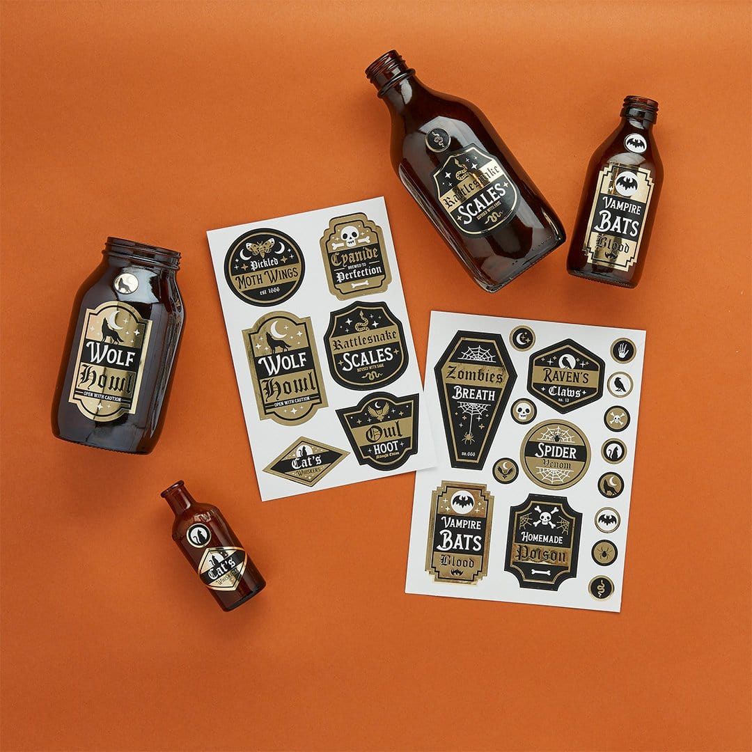 Hootyballoo Halloween potion label sticker sheets featuring Wolf Howl, Snake Scales, Vampire Bats designs, printable bottle labels for Halloween party drinks, spooky beverage stickers for DIY Halloween decorations