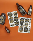 Hootyballoo Halloween potion label sticker sheets featuring Wolf Howl, Snake Scales, Vampire Bats designs, printable bottle labels for Halloween party drinks, spooky beverage stickers for DIY Halloween decorations