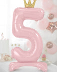 Pink number 5 balloon with a gold crown on a princess birthday party background