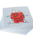 Stack of christmas napkins with a Snoopy and Woodstock design on a light blue background