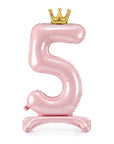 Pink inflatable number '5' with a gold crown on a white background