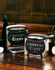 Personalized Halloween cauldron favour bags with custom names, black witch cauldron treat bags with gold foil accents, perfect for Halloween party favours and trick-or-treat loot bags