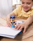 Preschooler stamping PAW Patrol stickers on activity pad, hands-on party game and creative entertainment for kids birthday parties or on the go travel activities