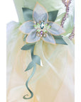 Close-up of Princess Tiana dress lily pad cameo with teal and purple sparkling gemstones and vine appliqué at waistline; Disney Princess girls' costume gown