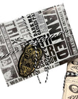 Harry Potter Dark Arts Gift Wrap Set with Daily Prophet newspaper-style wrapping paper featuring Bellatrix Lestrange Wanted posters and dark magic headlines, tied with black and white baker's twine and finished with a gold and black Death Eater mask die-cut gift tag; perfect for Harry Potter themed party gifts, birthdays, and Wizarding World celebrations