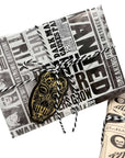 Harry Potter Dark Arts Gift Wrap Set with Daily Prophet newspaper-style wrapping paper featuring Bellatrix Lestrange Wanted posters and dark magic headlines, tied with black and white baker's twine and finished with a gold and black Death Eater mask die-cut gift tag; perfect for Harry Potter themed party gifts, birthdays, and Wizarding World celebrations