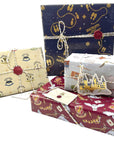 Complete Harry Potter gift wrap collection showing five different wrapping paper designs including Gryffindor red, Slytherin yellow, Hogwarts footprints, and gray magical icons with 3D Hogwarts castle decoration for themed party supplies
