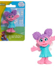 Sesame Street Abby Cadabby mini figurine, 2.5 inch pink fairy-monster with purple pom-pom pigtails, teal dress, and fairy wings