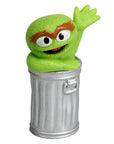 Sesame Street Oscar the Grouch mini figurine close-up, vivid green monster in metallic silver trash can, waving