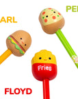 Close-up of Squishmallows squishy pen toppers: Carl the Cheeseburger, Floyd the French Fry, and Pep the Pizza