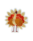 A die cut thanksgiving turkey paper napkin featuring a colorful turkey design with gold foil details.