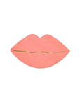 A pink lip-shaped napkin with gold foil details on the edge.