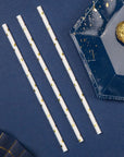 Pajitas de papel con estrellas doradas