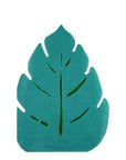 A die-cut paper napkin shaped like a tropical leaf with green foil details on a white background.