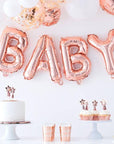 Bannière de ballons pour bébé en or rose