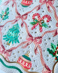 Christmas-themed pattern with ribbons, candy canes, and ornaments on a white background.