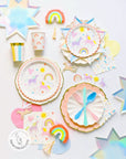 Meri Meri Unicorn rainbow birthday party supplies featuring magical unicorn plates, cups, rainbow decorations, pastel colors and whimsical party tableware for girls birthday celebration