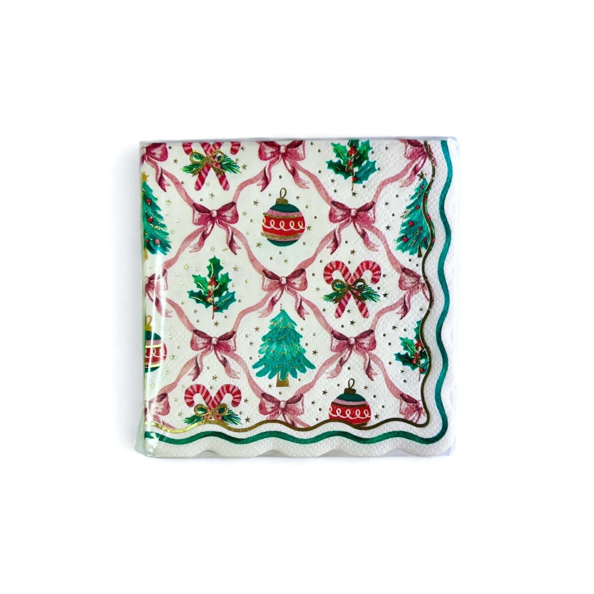 Christmas-themed paper napkin with bow ribbons, candy canes, and ornaments on a white background