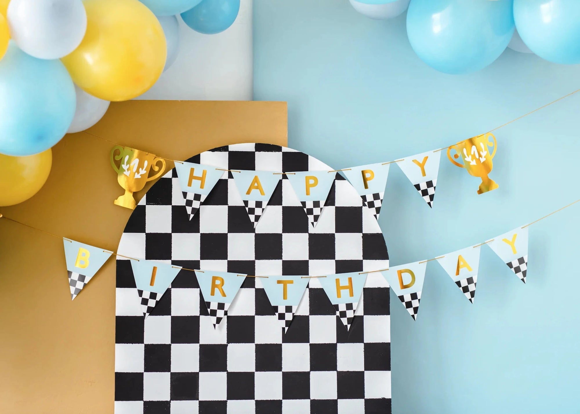 Checkered birthday banner with 'Happy Birthday' text and balloons on a blue background