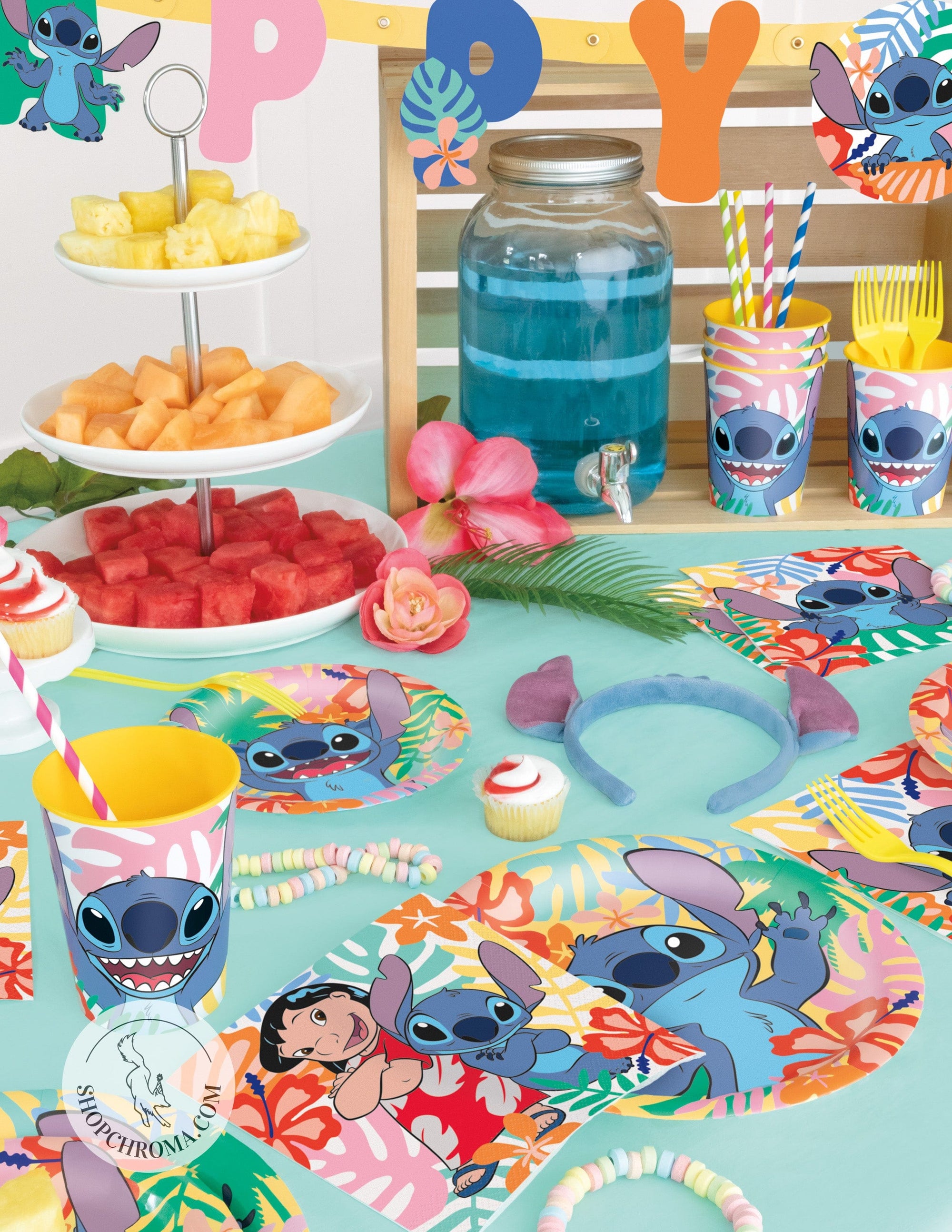 Lilo and Stitch Hawaiian birthday party supplies with tropical blue drinks, character plates, cups, napkins, fruit platter and island themed decorations for Disney kids party