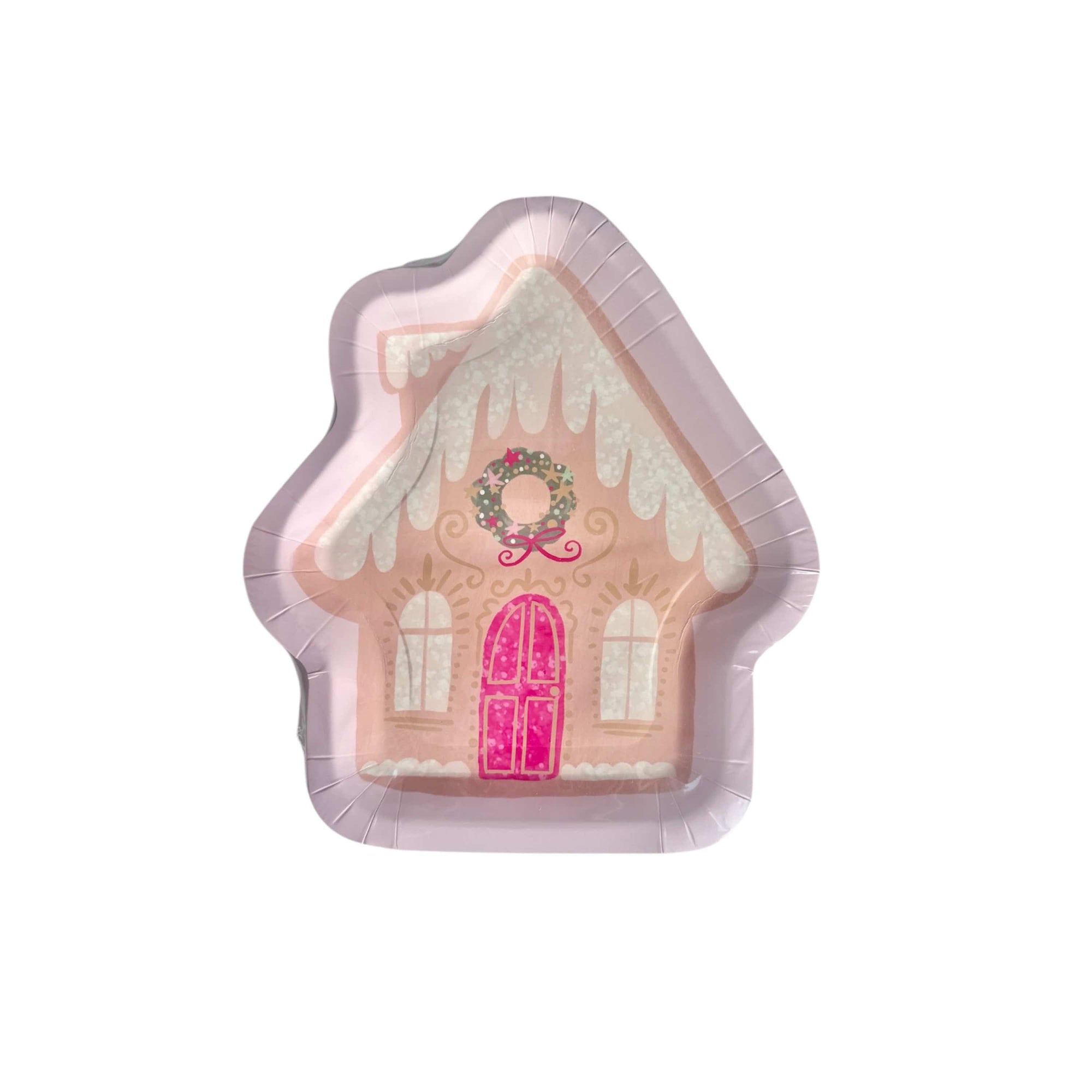 Gingerbread house-shaped paper plates with pink door and white roof on a pink background