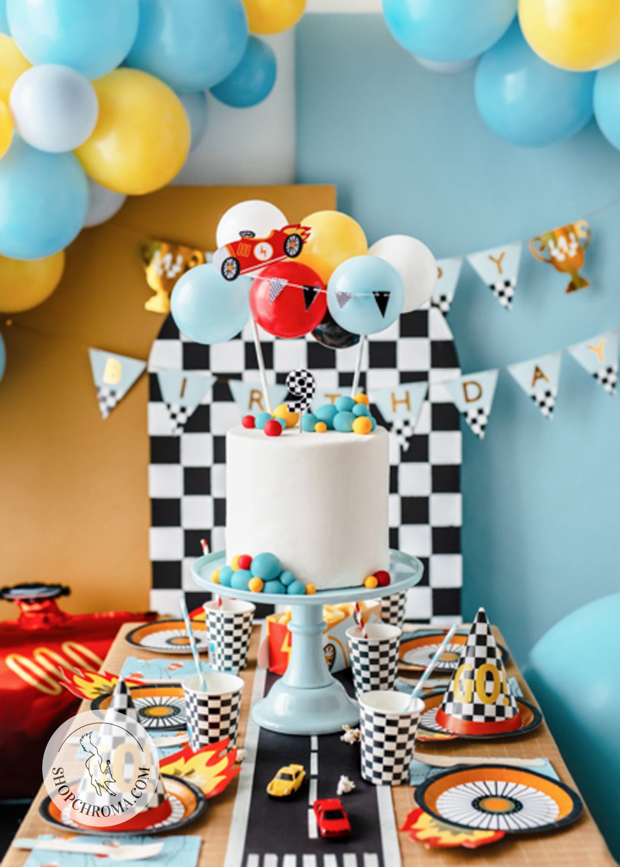 Race car party decorations with tire plates checkered balloons Happy Birthday banner - racing themed cake table setup with car party supplies