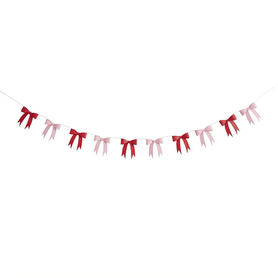 Bunting with red and pink ribbons on a white background