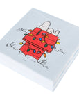 Christmas napkins with a cartoon design of a snoopy the dog from peanuts with Christmas lights on a light blue background