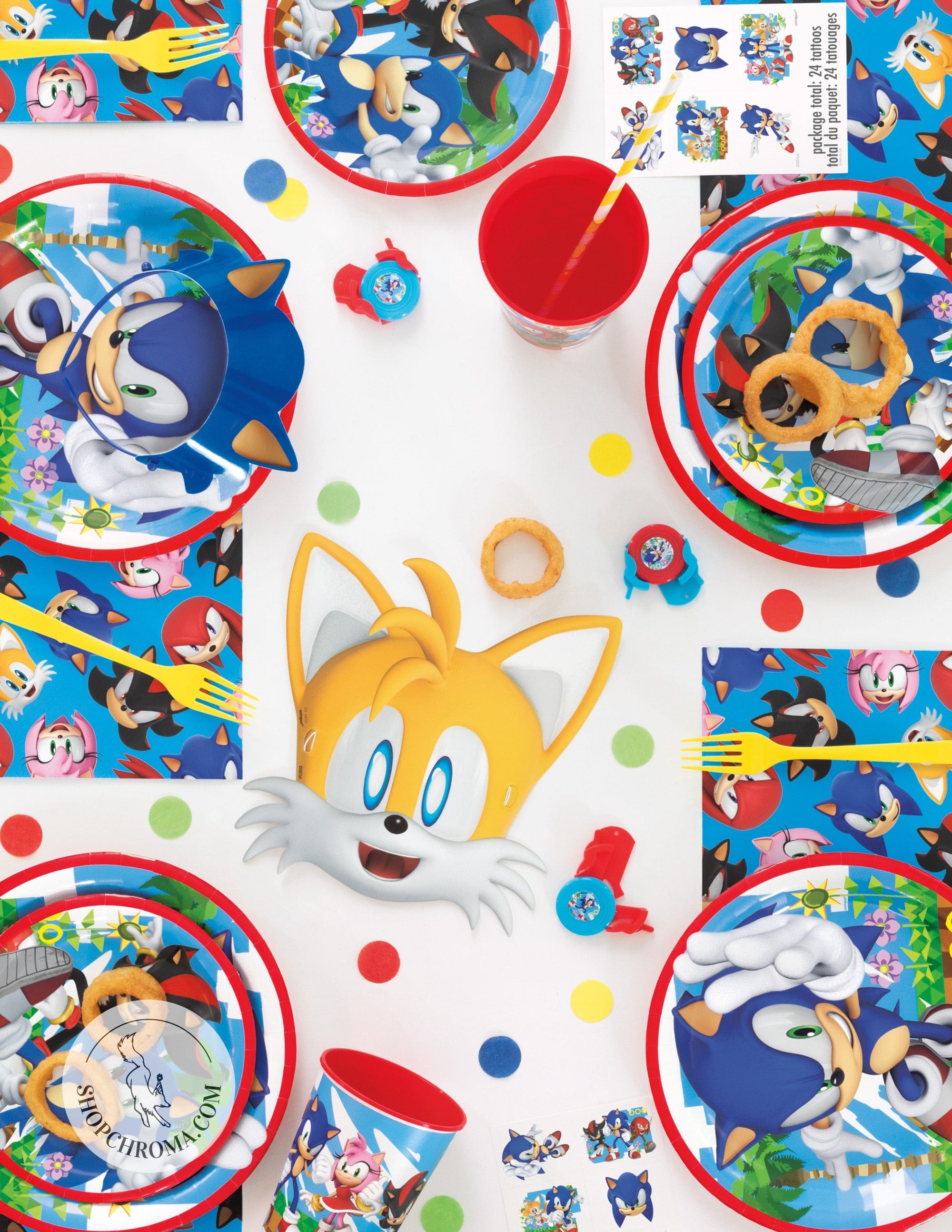 Sonic the Hedgehog party tableware flatlay featuring character plates, cups, napkins with Sonic, Tails, and friends design for children's birthday party