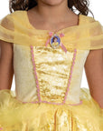 Close-up of Disney Belle prestige costume  dress glitter bodice with Belle cameo, pink rose trim, and Beauty and the Beast gold icon print panel