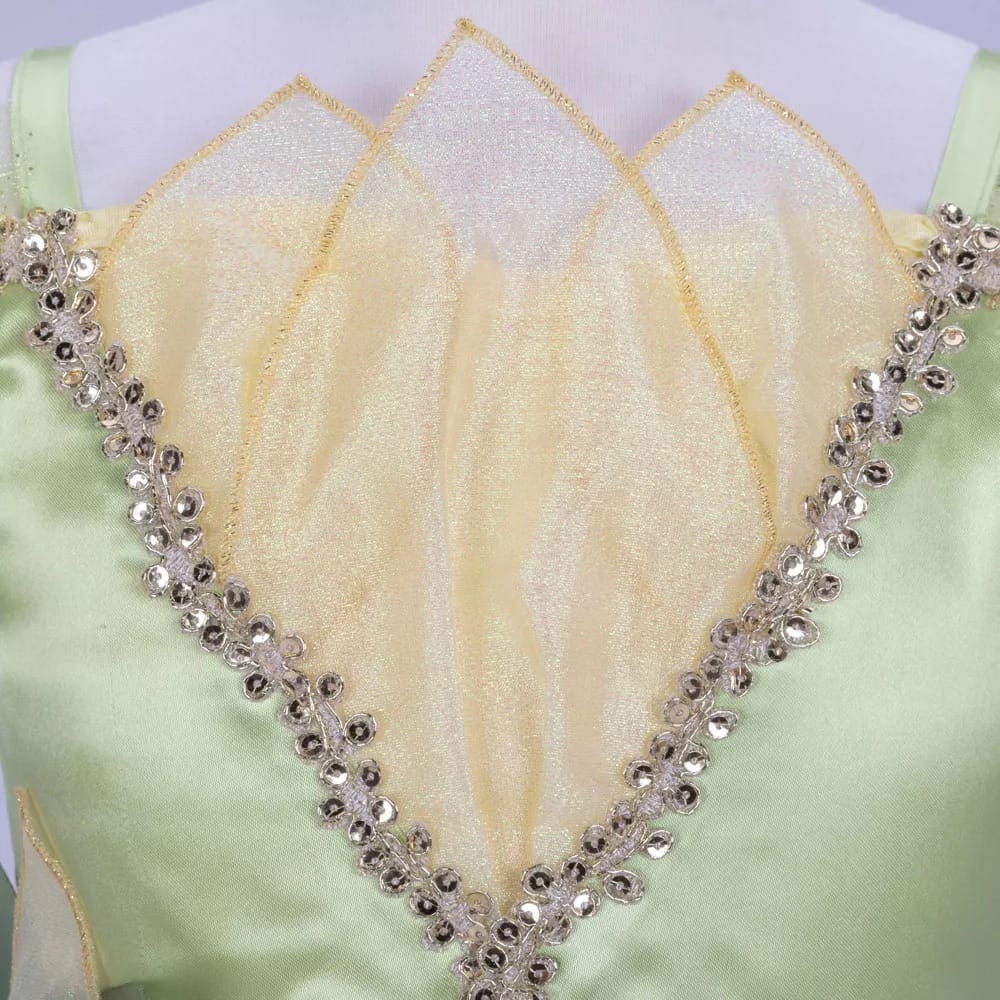 Close-up of Tiana costume dress bodice with iridescent organza petals and gold sequin trim; Disney Princess Signature Collection girls' costume dress