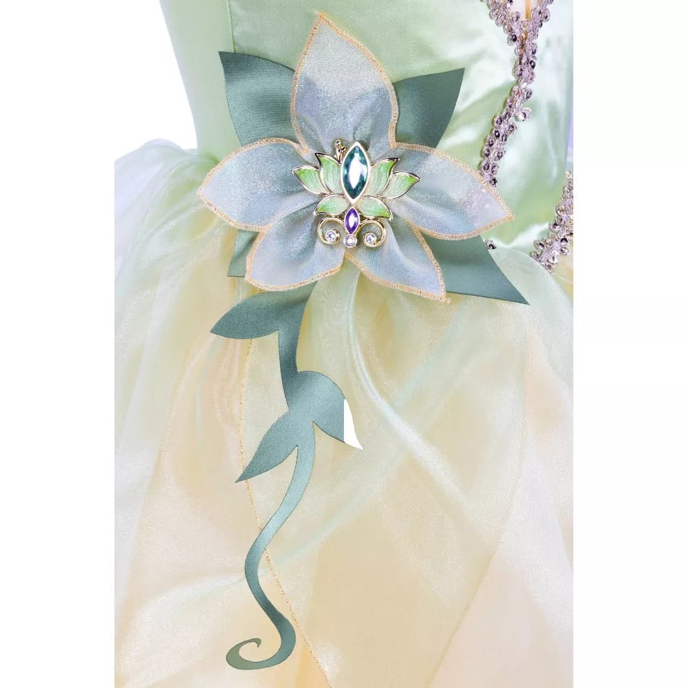 Close-up of Princess Tiana dress lily pad cameo with teal and purple sparkling gemstones and vine appliqué at waistline; Disney Princess girls' costume gown
