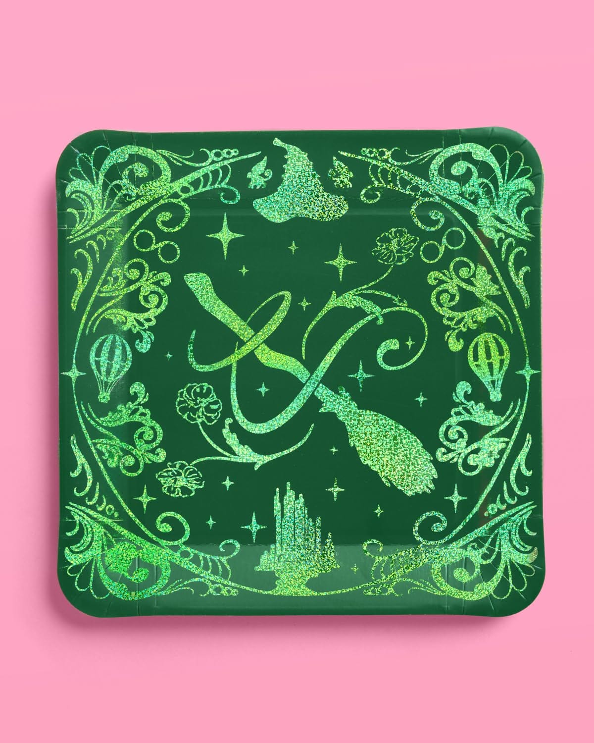 Green Wicked party plate with glitter foil witch hat, broom, and Emerald City skyline design
