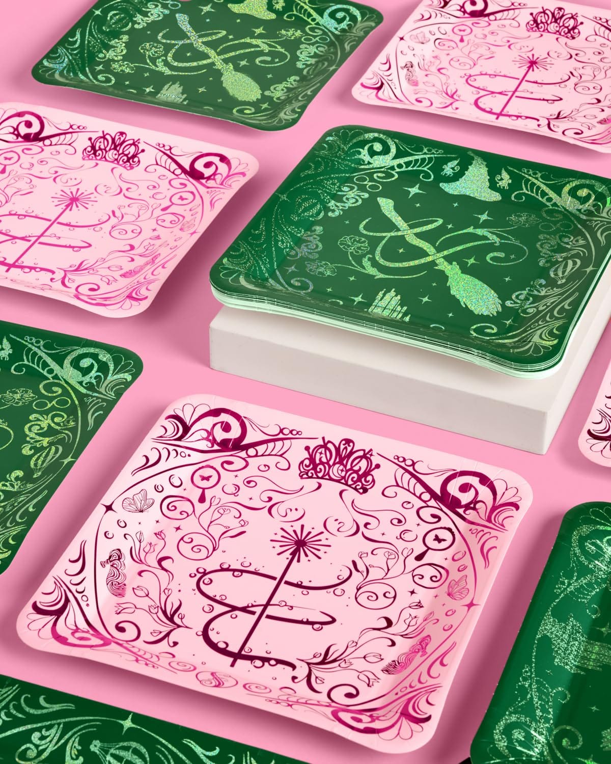 Emerald City Wicked plates in pink and green arranged on a pink table, square 10.5 inch dinner size