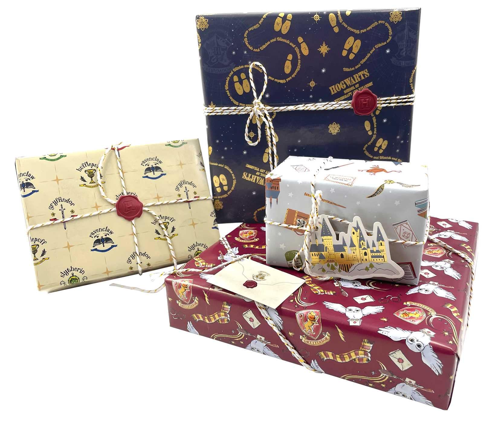 Complete Harry Potter gift wrap collection showing five different wrapping paper designs including Gryffindor red, Slytherin yellow,  Hogwarts footprints, and gray magical icons with 3D Hogwarts castle decoration for themed party supplies