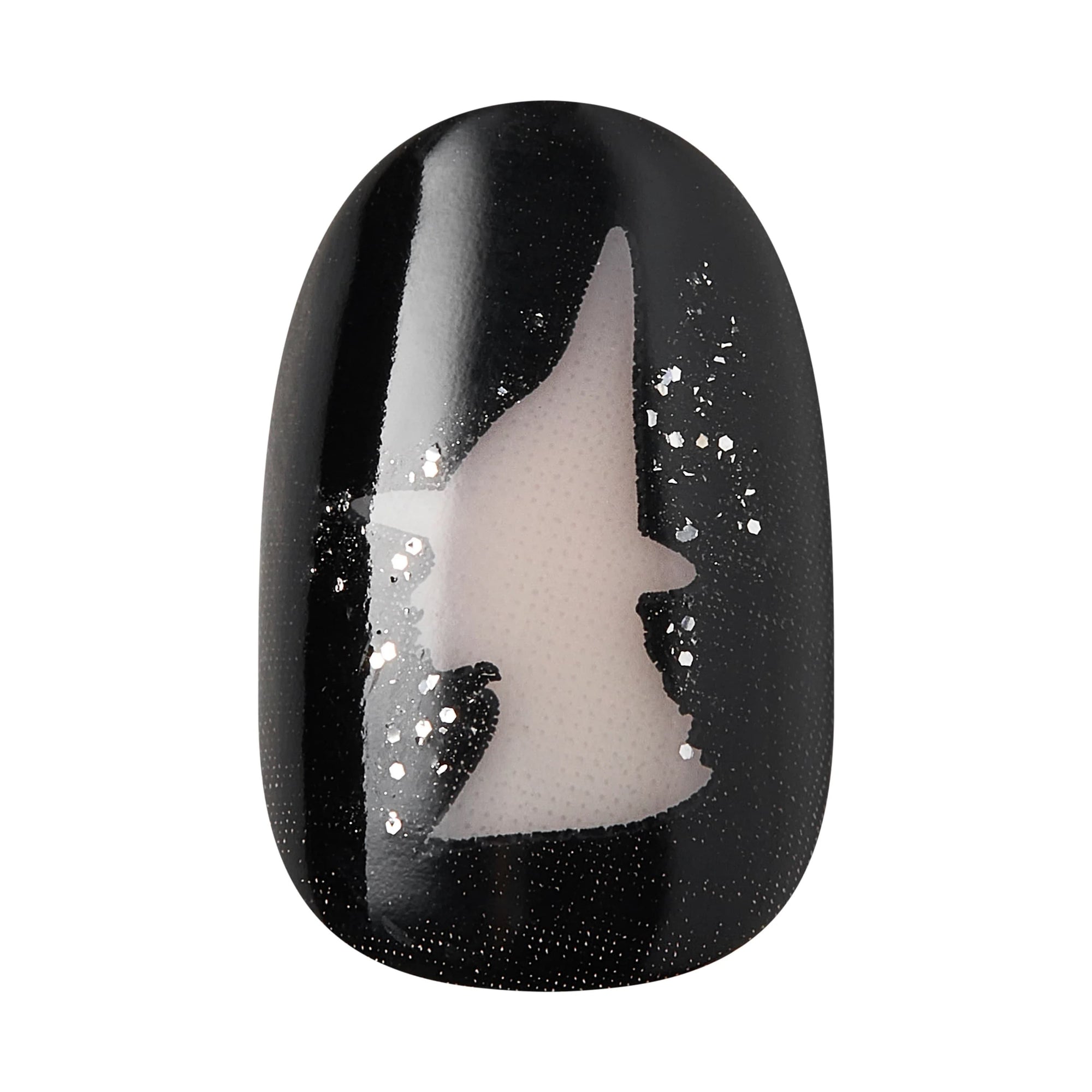 Close-up of Kiss x Wicked For Good black press-on nail with Elphaba witch hat silhouette and silver glitter; glow-in-the-dark fake nails; wicked party favours