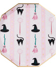 Witch hat and broom party plate with black cats, magic wands, brooms, and gold stars on pink striped background