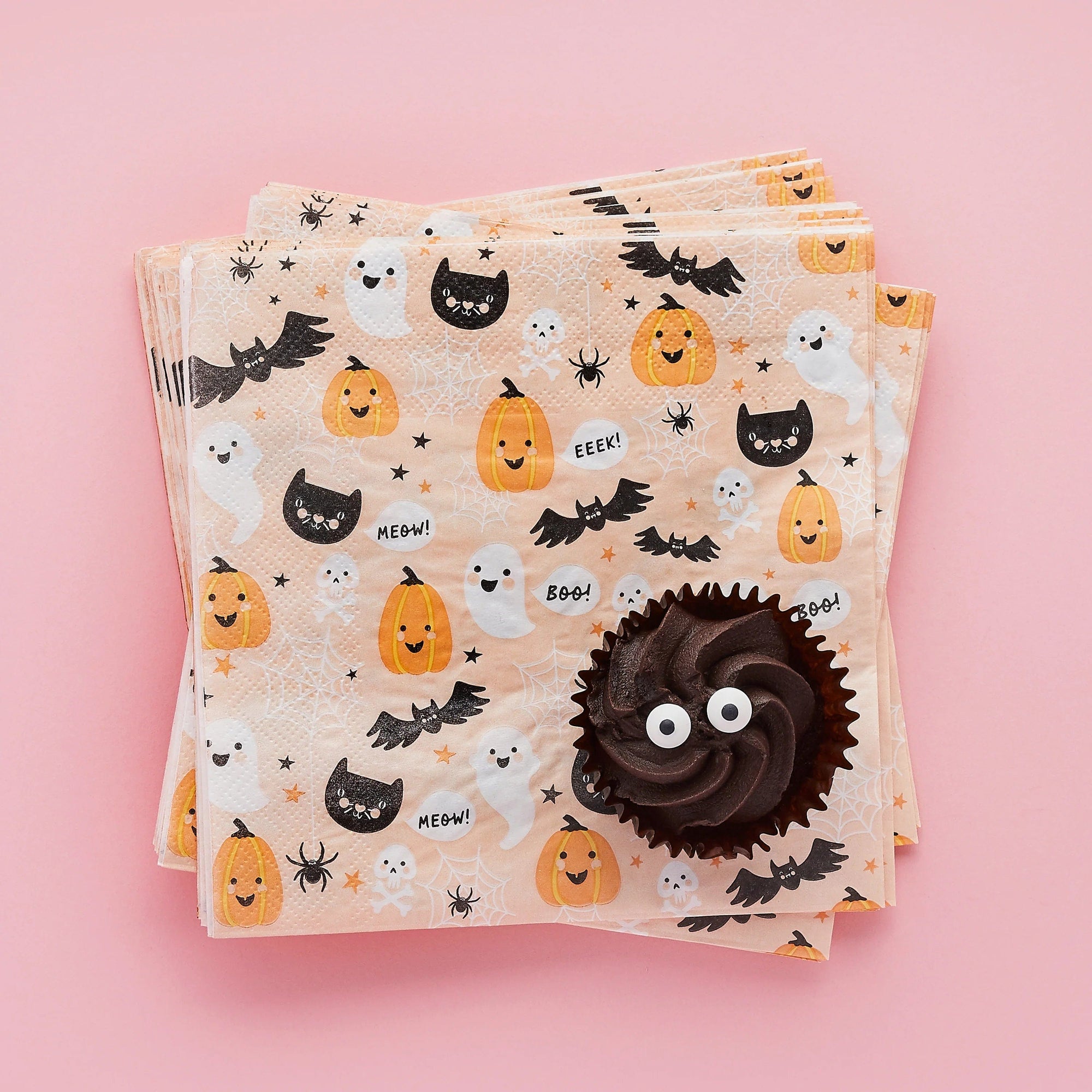 Pastel Halloween party napkins with chocolate cupcake - cute Halloween themed disposable napkins featuring pumpkins, ghosts, and black cats perfect for Halloween birthday party supplies