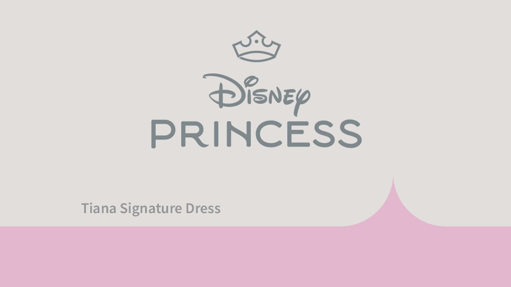 Video of girl modelling Disney Princess Tiana Signature Collection costume dress in green and yellow with organza skirt and lily pad cameo