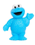 A blue Cookie Monster toy figure with white eyes and a wide open smile, standing against a plain white background.