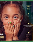 Child wearing Wicked kids press-on nails in green and gold with witch hat designs and Perfect Duet feature callouts