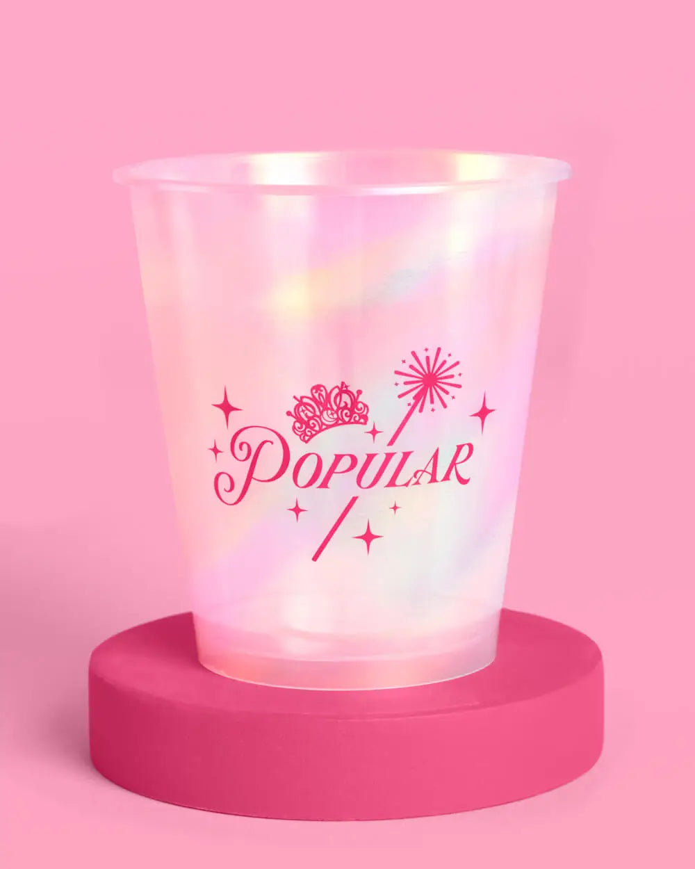 Wicked Popular pink iridescent party cup closeup showing crown wand and sparkle design on pink background