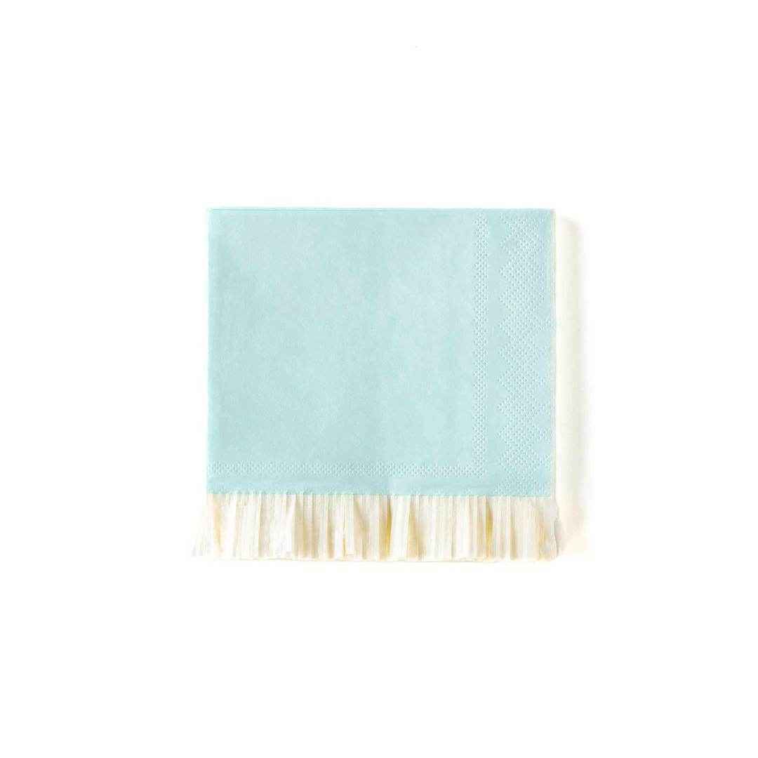 A My Mind's Eye baby blue fringe napkin with a white fringe, displayed on a white background.