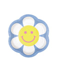 A paper plate with a smiley daisy design, featuring a yellow smiley face in the center, surrounded by a floral pattern with petals.