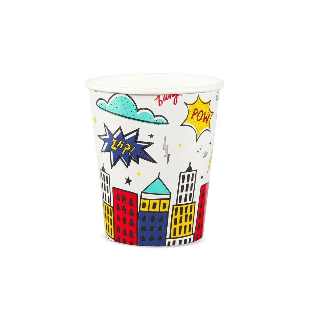 A paper cup with colorful comic book inspired design, featuring buildings and superhero motifs, and silver foil details.